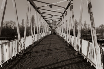 An old rusty bridge, an old dilapidated bridge, black and white photo