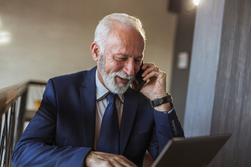 Senior businessman having a phone conversation