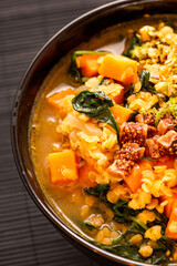Indian Curry Soup in Bowl with Fresh Ingredients
