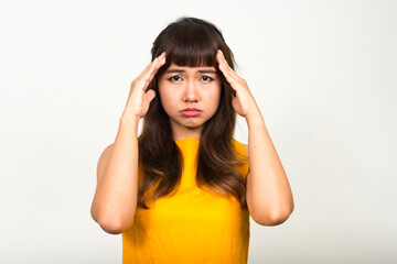 Portrait of stressed young Asian woman having headache