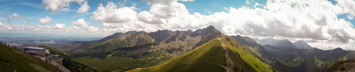 Summer panoramic view of Tatra Mountains, Kasprowy Wierch. Panorama landscape. Hiking concept scenery.