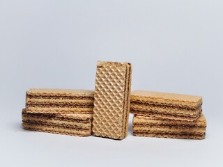 Vanilla wafers isolated on white background. Wafers filled with chocolate and vanilla cream. Crunchy dessert.