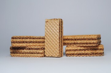 Vanilla wafers isolated on white background. Wafers filled with chocolate and vanilla cream. Crunchy dessert.