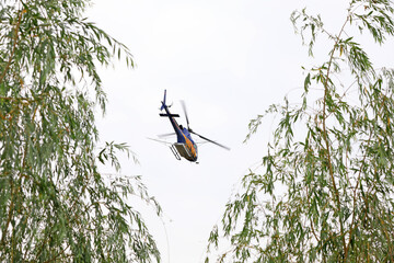 Agricultural helicopters fly in the sky