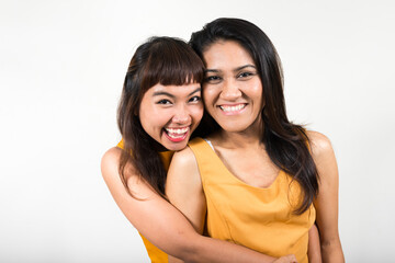 Portrait of two happy young Asian women together