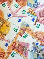 Paper money of the euro on a white background neatly laid out, straight, smooth. Denomination twenty, ten, fifty, five euros. Savings. Saving. Credit. Spare pillow for a rainy day.