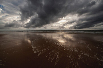 dark clouds over the sandy beach