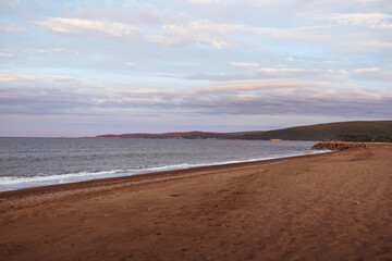 Fototapeta na wymiar The view from the beach on beautiful sunset on Cape Breton Island