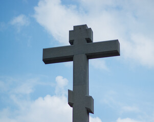 stone cross against the sky