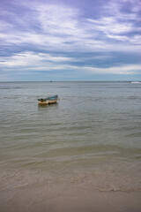 Fototapeta na wymiar a lonely boat on the beach, Hua Hin Thailand