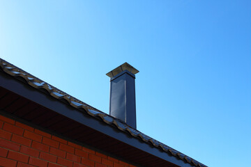 Chimney on the roof of the house. Close-up. Background. Texture.