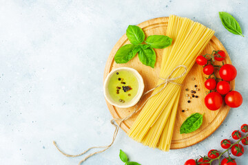 Italian food - pasta ingredients concept on grey stone background, copy space, flat lay