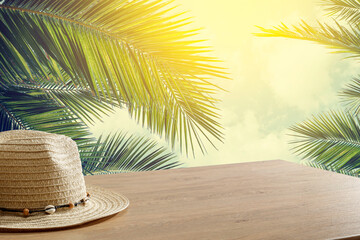 hat on a wooden table surrounded by a beautiful background with free space for an advertising...