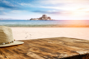 hat on a wooden table surrounded by a beautiful background with free space for an advertising...