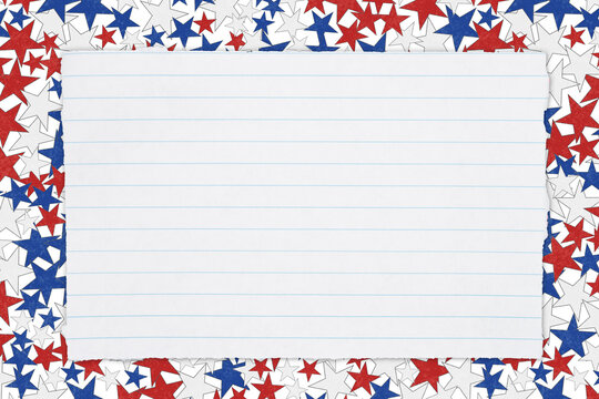 Torn piece of white notepad paper with lines on red, white and blue stars paper background