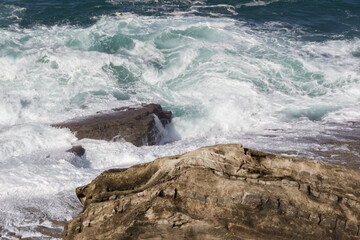 Bay of Biscay. Raging force of nature. Waves lick stones and beat against rocks. Spanish coast....