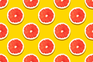 Seamless pattern with a slice of grapefruit on a yellow background. Drawing for decoration, packaging, banner. advertising.