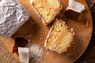 Traditional iced cake with coconut and milk sweet wrapped in aluminum foil.