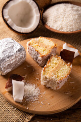 Traditional iced cake with coconut and milk sweet wrapped in aluminum foil.
