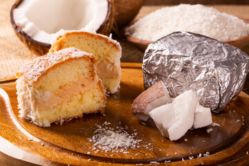 Traditional iced cake with coconut and milk sweet wrapped in aluminum foil.