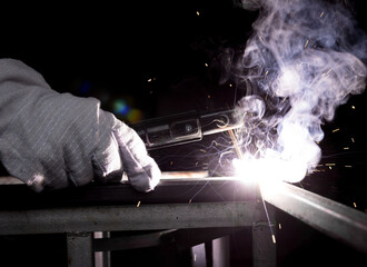 Hand arc welding metal  assembly object industrial construction welder working steel beginner...