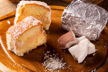 Traditional iced cake with coconut and milk sweet wrapped in aluminum foil.