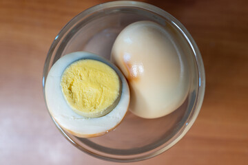 Close-up of baked eggs in a clear cup