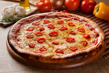 Traditional italian pizza on wooden.