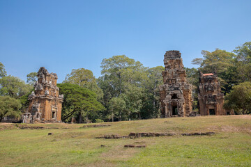 Fototapeta na wymiar Ancient Preah Palilay temple in Angkor Thom and huge Banyan trees, Angkor, Cambodia.