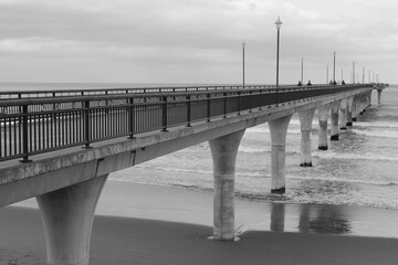 Fototapeta na wymiar A bridge into the ocean. Boardwalk in Christchurch, New Zealand