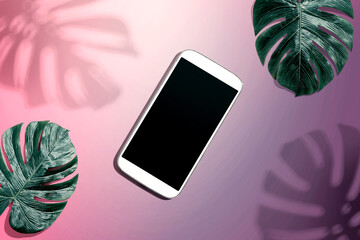 Smartphone with tropical monstera leaves and shadow - flat lay © Tierney