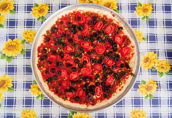 Pizza with tomatoes and black olives