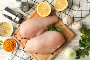 Composition with raw chicken meat on wooden background, top view