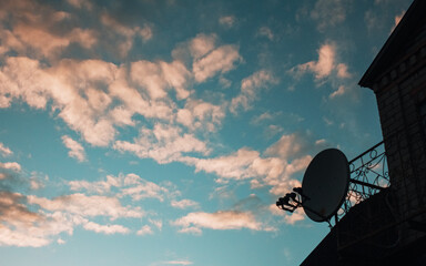 Cloudy blue sky background near a house