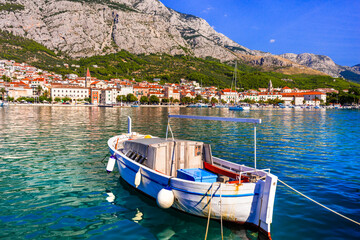 Croatia summer holidays - famous Adriatic coast - Makarska riviera in Dalmatia. Charming marine with fishing boats.