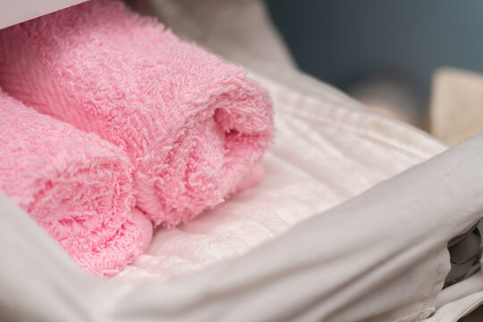 pink towels in a drawer