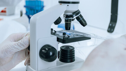 close up. scientist using a microscope in a modern laboratory.