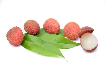 red ripe lychee with green leaves isolated on white background.