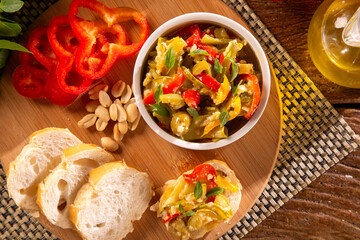 Cooking of zucchini salad with vegetables , tomatoes, pepper, olive and vegetable oil.