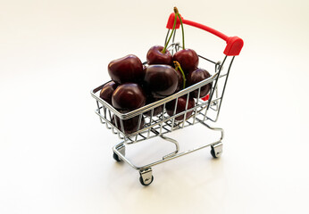 fresh juicy delicious cherries in a small cart