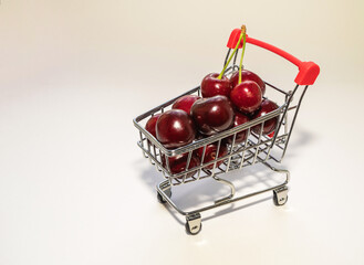 cherries in a grocery cart