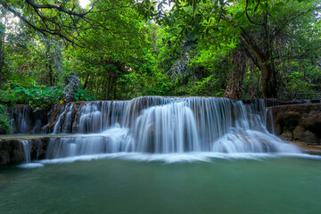 Beautiful deep forest waterfall in Kanchanaburi, Thailand.
