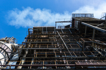 Low angle shot of Industrial and blue sky