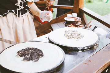 The process of cooking pancakes.