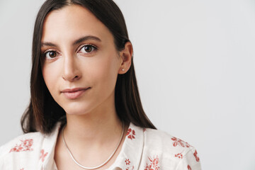 Photo of serious beautiful woman posing and looking at camera