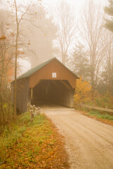 Covered Bridge No 23 in New Hampshire. It is on a Gravel winding road snaking through a forest of autumn colors in near Cornish,