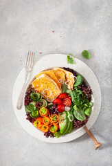 ketogenic paleo diet lunch bowl. halloumi cheese, avocado carrot cucumber salad leaves