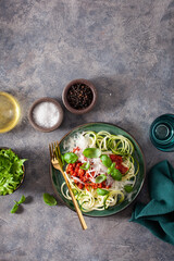 keto paleo zoodles bolognese: zucchini noodles with meat sauce and parmesan