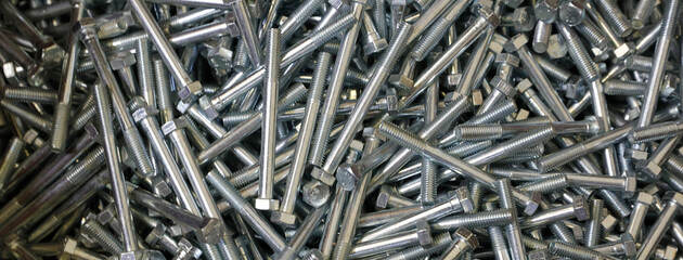 Shining bolts blue toned photo and bolts / background. Industry, metal. are used in construction.