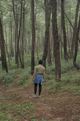 Obraz premium man walking in forest